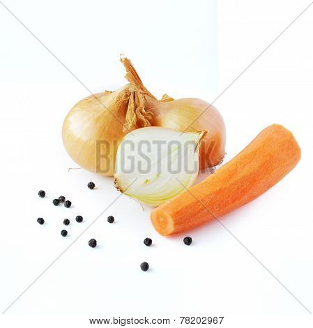 Onions, carrot and pepper prepared for cooking on white backgrou