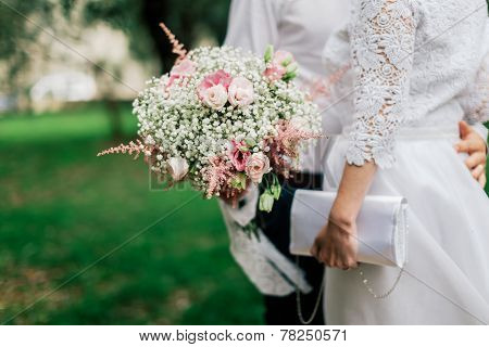 Wedding Bouquet In Groom's Hands Closeup