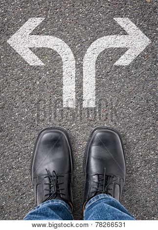 Two arrows on the floor pointing in two directions