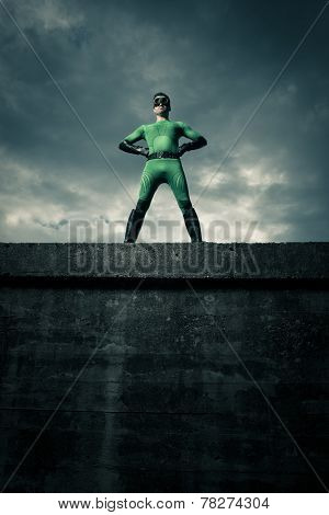Confident Superhero Standing On A Wall