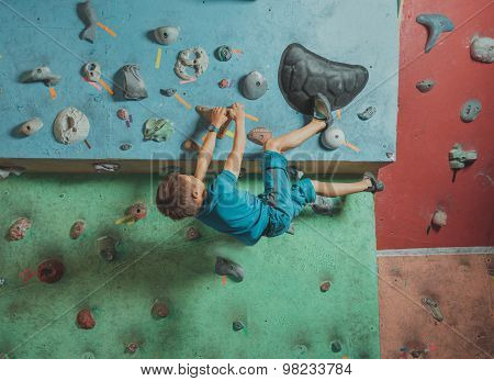 Boy Climbing In Gym