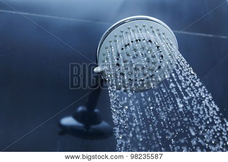 Shower Head In Bathroom With Water Drops Flowing