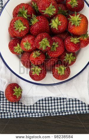 Fresh Juicy Strawberries On Vintage Enamelware Crockery On Rustic Background