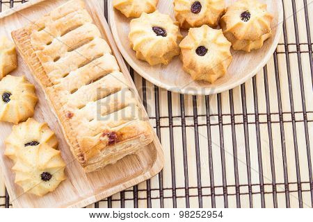 Pineapple Pie And Cookies In Wooden Plate On Wooden Table