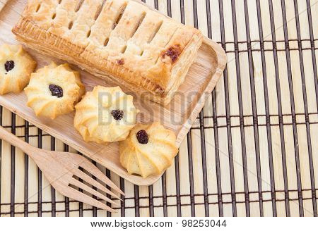 Pineapple Pie And Cookies In Wooden Plate On Wooden Table