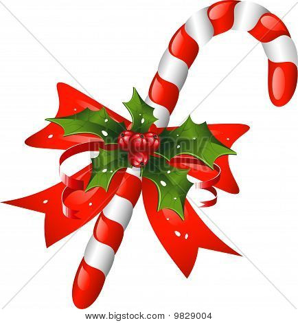 Canna di caramella di Natale decorato con un fiocco e holly