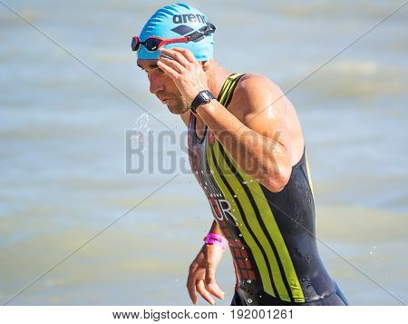 Pescara Italy - June 18 2017: Arrival of the first athletes at the end of the swimming test at Ironman 70.3 in Pescara