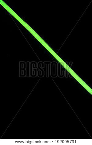 Glow sticks neon light fluorescent on back background. variation of different colored chem lights