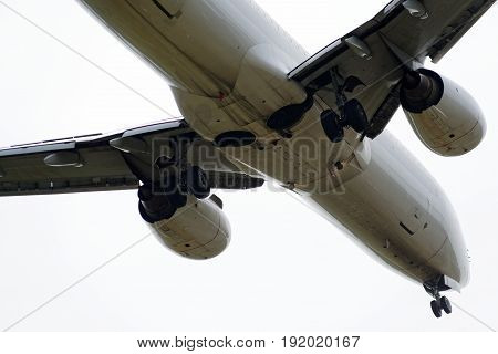 The underside of a modern airplane and its landing gear