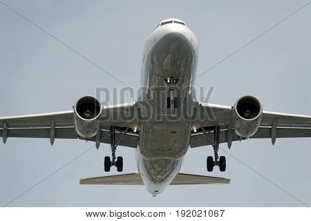 The underside of a modern airplane and its landing gear