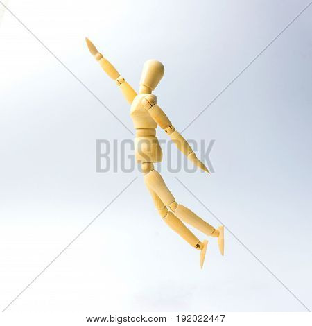 Wooden figure doll with jumping to grap emotion for success business concept.
