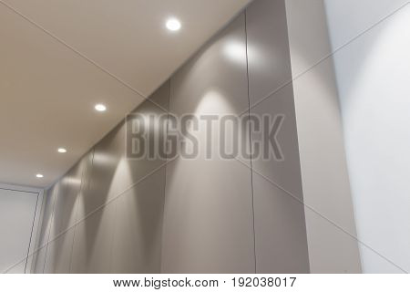 Office Doorway Panel Wall With Overhead Lighting