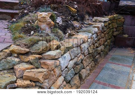 Dry wall without mortar. Wall of stacked stone slabs.
