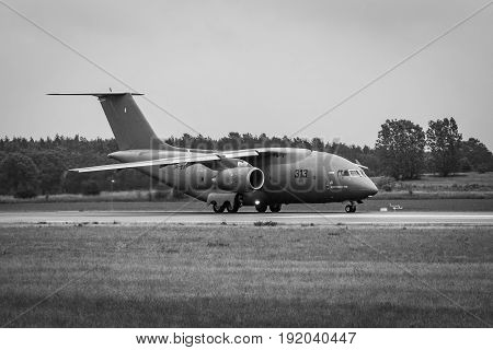 BERLIN GERMANY - JUNE 01 2016: Preparing for takeoff military transport aircraft Antonov An-178. Black and white. Exhibition ILA Berlin Air Show 2016