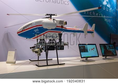 BERLIN GERMANY - JUNE 01 2016: The stand of German Aerospace Center (DLR). Helicopter Drone SuperARTIS (Autonomous Rotorcraft Testbed for Intelligent Systems). Exhibition ILA Berlin Air Show 2016.