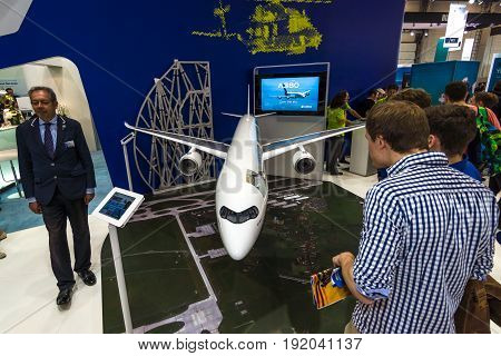 BERLIN GERMANY - JUNE 01 2016: The stand of Airbus Group. Model of passenger airliner Airbus A350-1000. Exhibition ILA Berlin Air Show 2016.