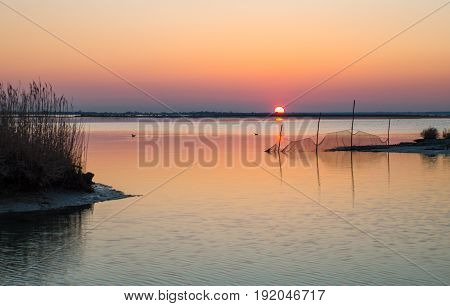 Italy Po delta park sunset on the Goro lagoon