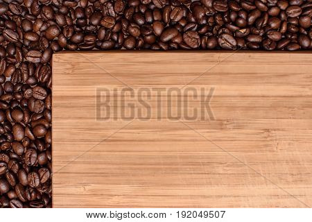A Wooden Background Around The Edges Sprinkled With Roasted Grain Coffee, Space For Text