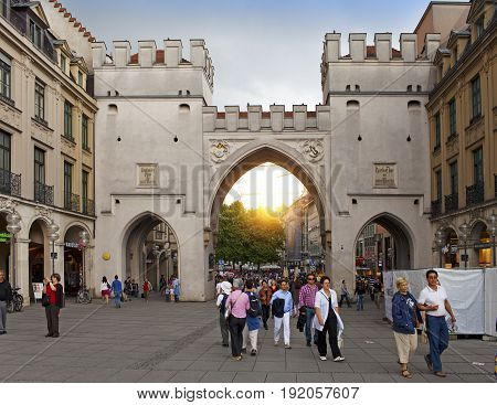 Munich Germany - May 29 2012: People walking through the Karlstor gate in Munich Germany.