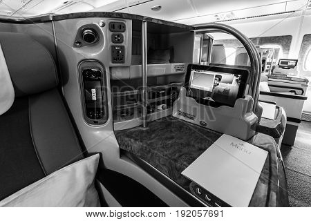 BERLIN GERMANY - JUNE 02 2016: Interior of business class of the world's largest aircraft Airbus A380. Emirates Airline. Black and white. Exhibition ILA Berlin Air Show 2016