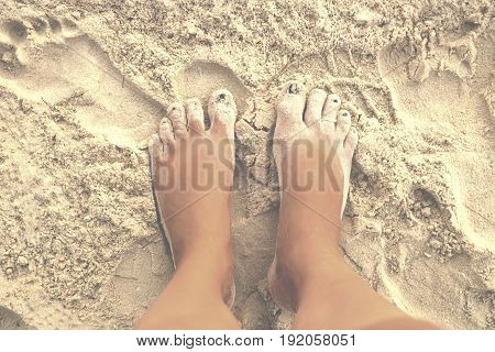 Feet at the beach on the sand of Otres Beach Cambodia