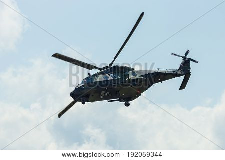 BERLIN GERMANY - JUNE 02 2016: Helicopter NH90 of the German Army. Demonstrative performance. Exhibition ILA Berlin Air Show 2016