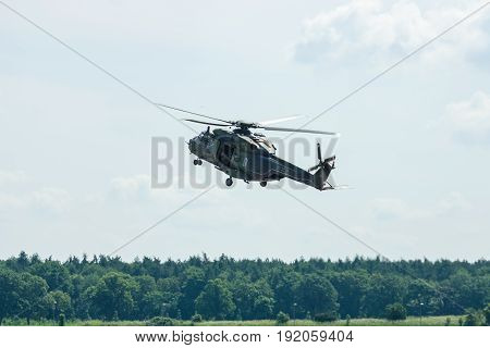 BERLIN GERMANY - JUNE 02 2016: Helicopter NH90 of the German Army. Demonstrative performance. Exhibition ILA Berlin Air Show 2016