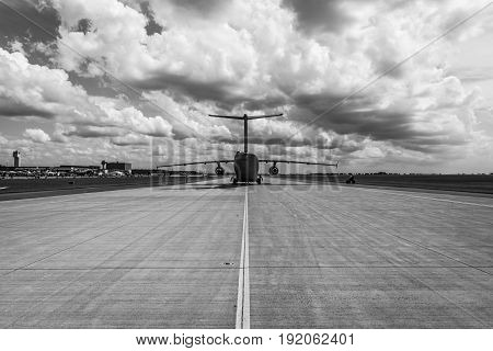 BERLIN GERMANY - JUNE 02 2016: Military transport aircraft Antonov An-178 on the taxiway. Waiting takeoff. Black and white. Exhibition ILA Berlin Air Show 2016