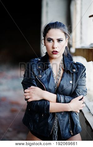 Brunette Plus Size Sexy Woman, Wear At Black Leather Jacket, Lace Panties And Chain At Abadoned Plac