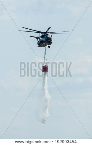 BERLIN GERMANY - JUNE 03 2016: Heavy-lift cargo helicopter Sikorsky CH-53 Sea Stallion of the German Army with equipment for fighting fires. Exhibition ILA Berlin Air Show 2016