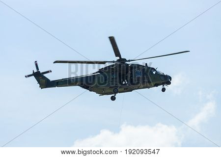 BERLIN GERMANY - JUNE 03 2016: Helicopter NH90 of the German Army. Demonstrative performance. Exhibition ILA Berlin Air Show 2016