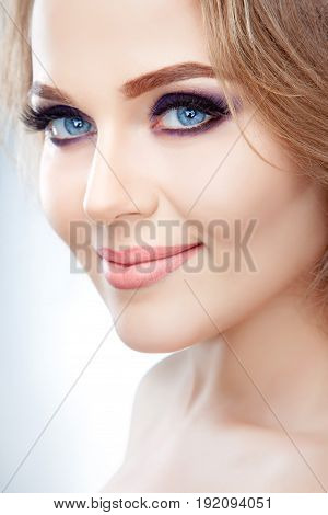 High fashion look close up beauty portrait of beautiful young woman model with bright makeup with perfect clean skin
