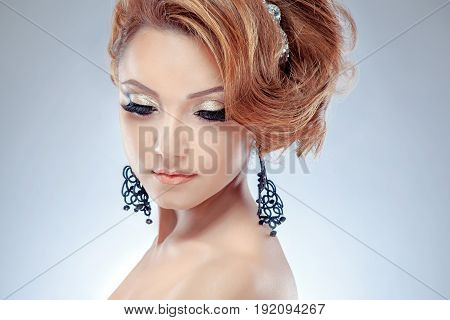 High fashion look close up beauty portrait of beautiful young woman model with bright makeup with perfect clean skin