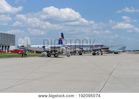 BERLIN GERMANY - JUNE 03 2016: A piston-powered airliner and transport aircraft Douglas DC-6 and American twin-engine medium bomber North American B-25J Mitchell. The Flying Bulls Team. Exhibition ILA Berlin Air Show 2016