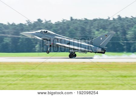 BERLIN GERMANY - JUNE 03 2016: Landing multirole fighter Eurofighter Typhoon. Exhibition ILA Berlin Air Show 2016