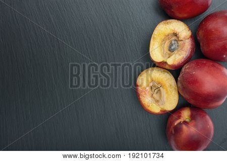 Ripe Nectarine On Black Background Of Slate Or Stone