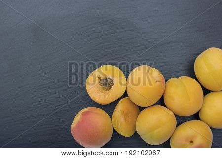 Ripe Apricot On Black Background Of Slate Or Stone