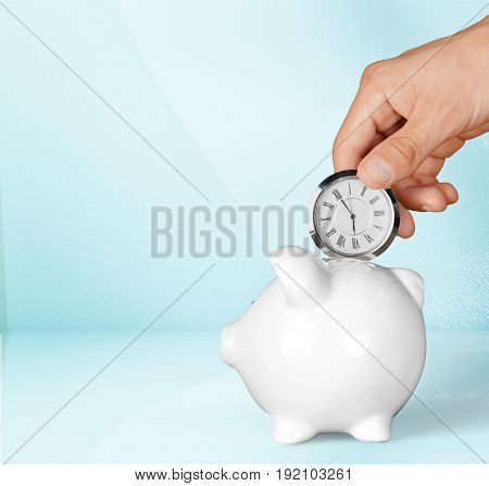 Hand clock bank pig piggy time is money background