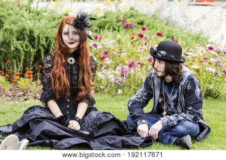CAGLIARI, ITALY - JUNE 1, 2014: Sunday at the Great Jatte Public Gardens - Pair of young people wearing a Victorian-style costume - Sardinia