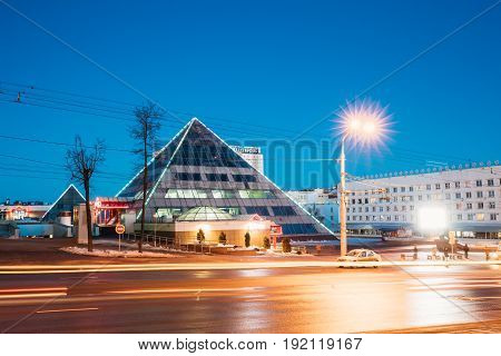 Vitebsk, Belarus - February 15, 2017: Shops In Pyramid Shape In Lenin Street At Winter Season. View From Gogol Street In Evening Or Night Illumination In Vitebsk, Belarus