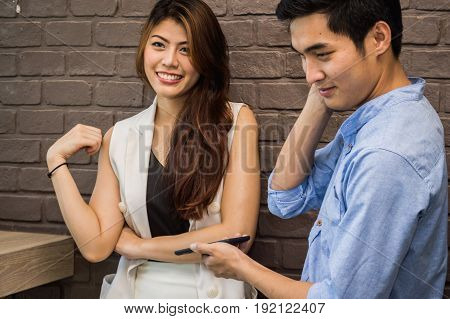 A young man is asking for a girl number in a coffee shop.