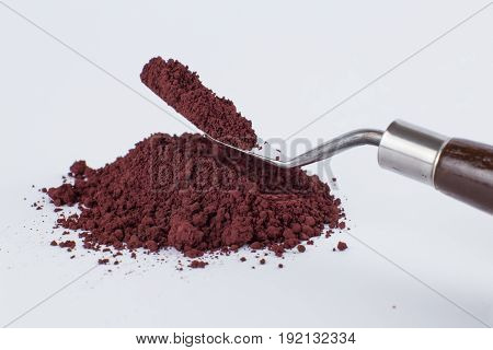 caput mortuum dark pigment on a white background