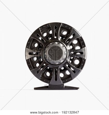 Fly Reel grey on white background. Fly reel for fly fishing. Fly reel close-up.