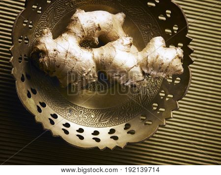 top shot of ginger on metal plate