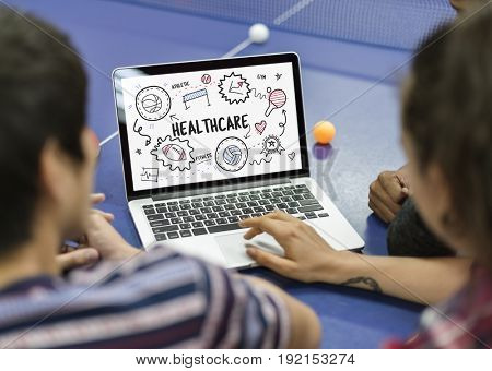 Students working on laptop network graphic overlay