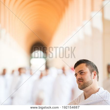 Muslim man enjoying his visit to holy mosque
