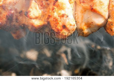 Lamb meat kebab prepares on the fire outdoors