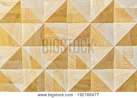 Abstract decorative ecological unpainted light wooden background with geomethrical mosaik wood pattern close-up, natural surface. Wood background texture.
