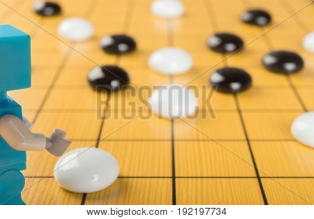 robot playing GO concept of AI horizontal composition
