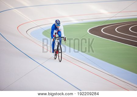 Cyclist pedaling on a racing bike outdoors